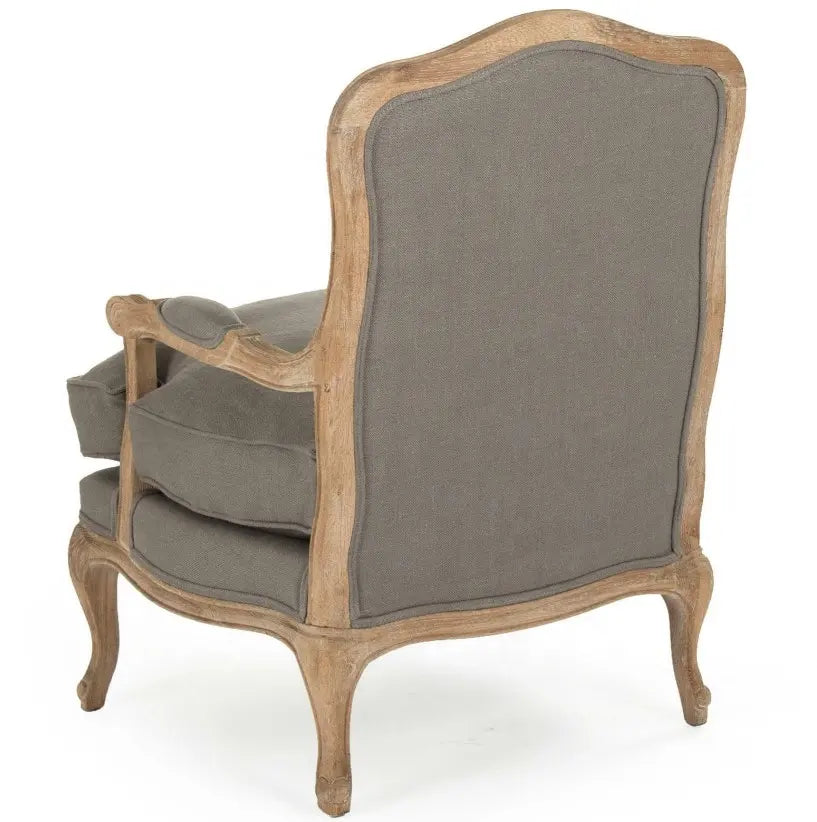 A classic French country style armchair with a weathered natural wood frame and comfortable grey linen upholstered cushions.