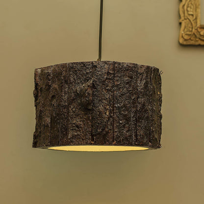 A rustic drum-shaped ceiling lamp featuring a realistic brown wood bark exterior.