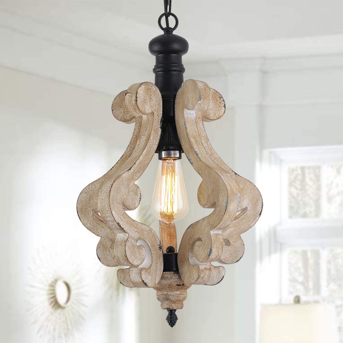 Distressed rustic wood scroll pendant light fixture with a warm vintage Edison bulb.
