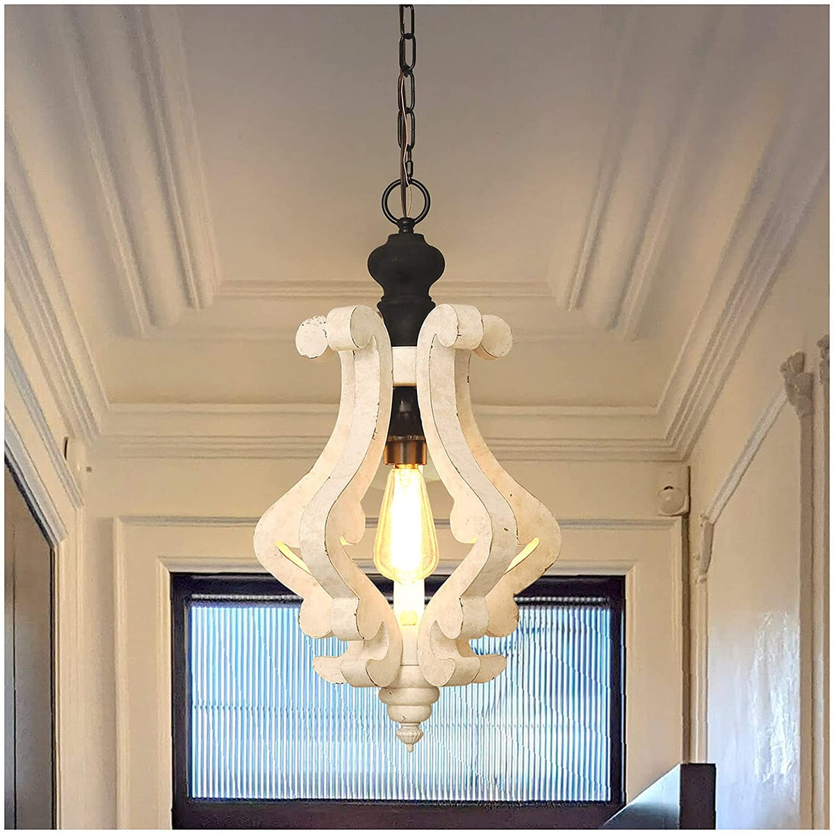 Distressed rustic wood scroll pendant light fixture with a warm vintage Edison bulb.