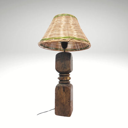 Handmade vintage wooden table lamp with an earthy wicker woven lampshade