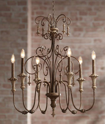 Vintage style iron chandelier featuring candle-style bulbs.