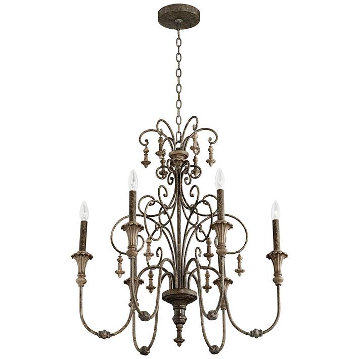 Vintage style iron chandelier featuring candle-style bulbs.