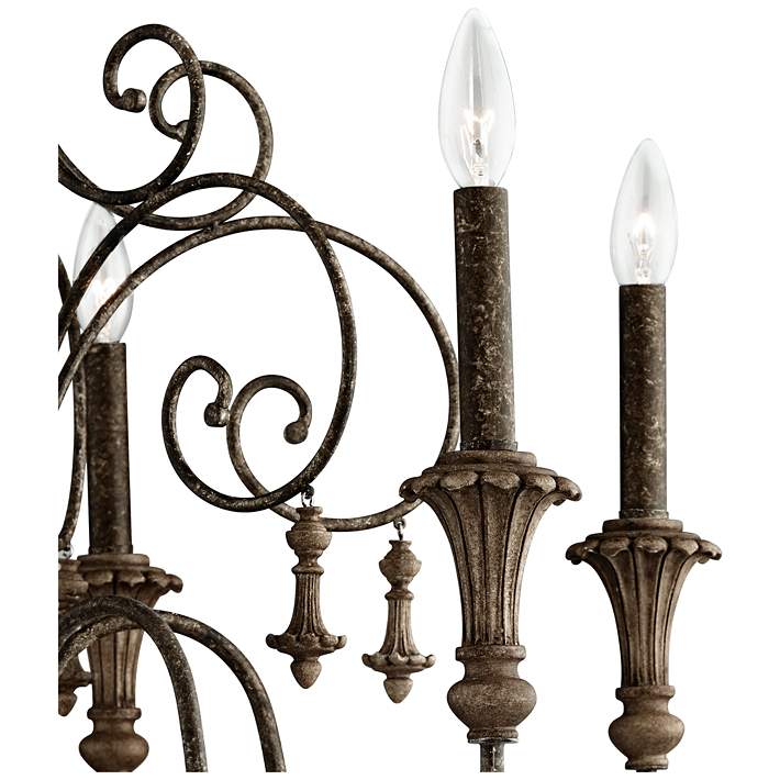 Vintage style iron chandelier featuring candle-style bulbs.