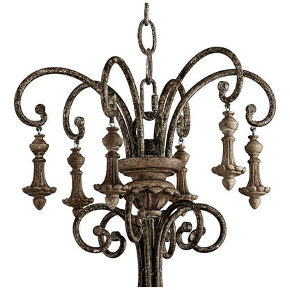 Vintage style iron chandelier featuring candle-style bulbs.