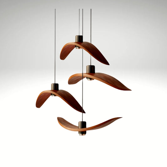 Minimalist Scandinavian ceiling chandelier featuring four bird-wing-shaped natural wood shades dangling at adjustable heights.