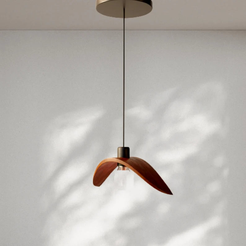 Minimalist Scandinavian ceiling chandelier featuring four bird-wing-shaped natural wood shades dangling at adjustable heights.