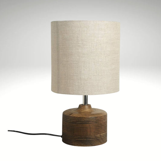 Minimalist rustic wooden bedside table lamp with grooved base detail and textured fabric shade, ideal for living room and bedroom decor.