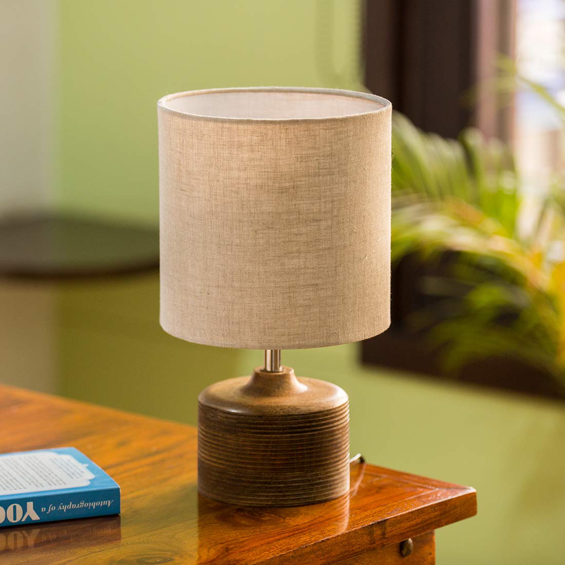 Minimalist rustic wooden bedside table lamp with grooved base detail and textured fabric shade, ideal for living room and bedroom decor.
