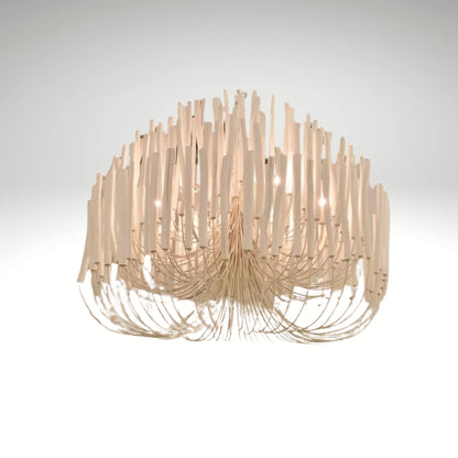 A modern white chandelier made of curved wooden sticks hanging in a tiered, organic shape.