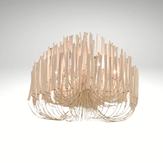 A modern white chandelier made of curved wooden sticks hanging in a tiered, organic shape.