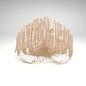 A modern white chandelier made of curved wooden sticks hanging in a tiered, organic shape.