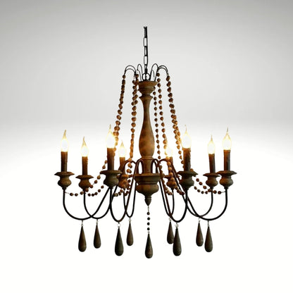 Antique candle-style farmhouse chandelier featuring dark wood finishes and bead strands.