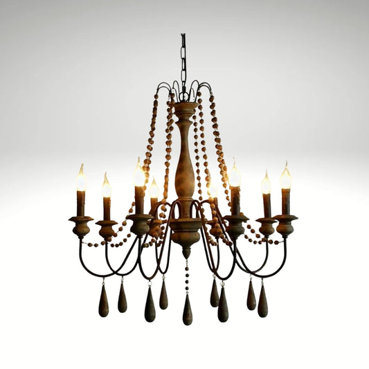 Antique candle-style farmhouse chandelier featuring dark wood finishes and bead strands.