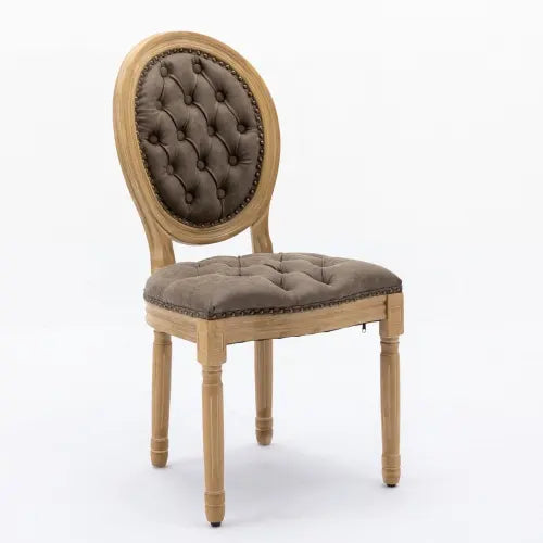 Classic French country dining chair featuring brown tufted cushions and distressed wooden legs.