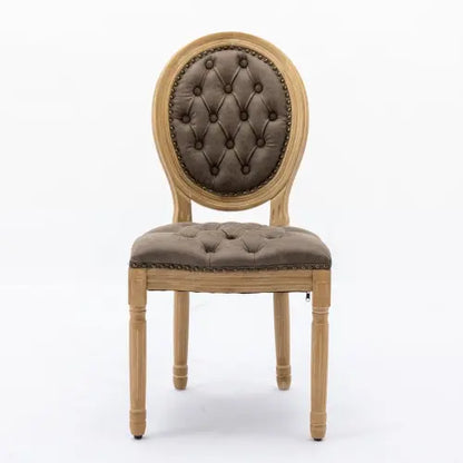 Classic French country dining chair featuring brown tufted cushions and distressed wooden legs.