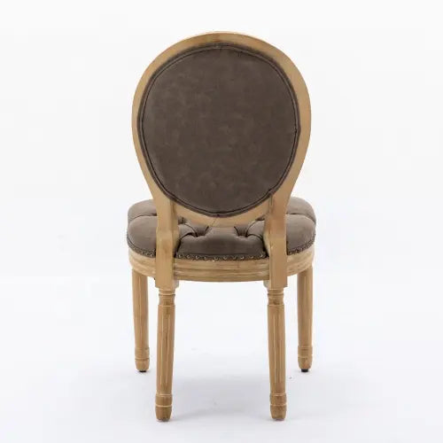 Classic French country dining chair featuring brown tufted cushions and distressed wooden legs.