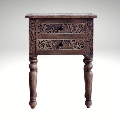 Traditional brown wooden side table featuring intricate floral carvings on two drawers.
