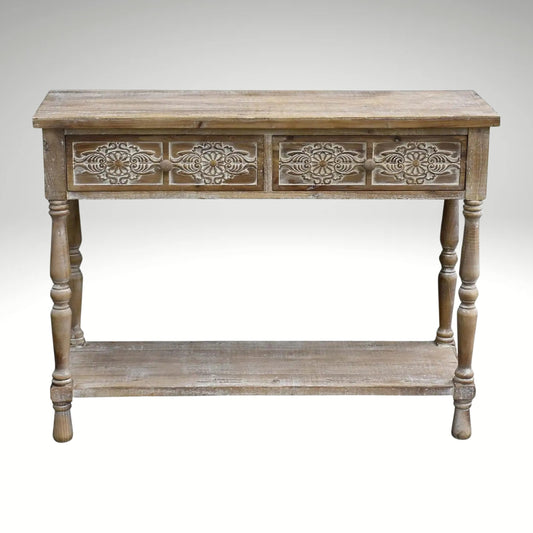 Vintage distressed wood entryway table featuring two drawers with decorative carved panels and a lower open shelf.