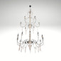A multi-tiered rustic white chandelier with distressed wood columns and black iron scrolled arms.