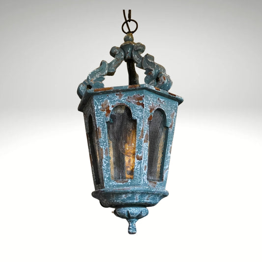 Distressed teal wooden hanging lantern with a rustic finish