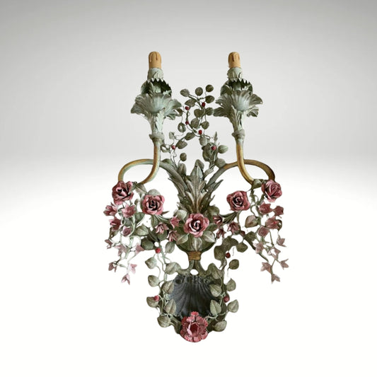 Antique double-light wall sconce with a detailed floral design, cascading pink flowers, and a weathered sage green finish.
