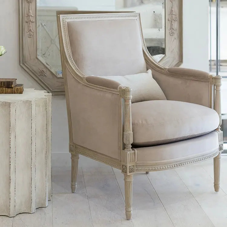 Vintage-style cream accent armchair with a padded seat and backrest
