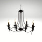 Elegant black wrought iron candelabra chandelier with six glowing bulb lights hanging from a chain against