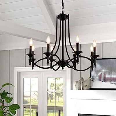 Elegant black wrought iron candelabra chandelier with six glowing bulb lights hanging from a chain against