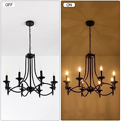 Elegant black wrought iron candelabra chandelier with six glowing bulb lights hanging from a chain against